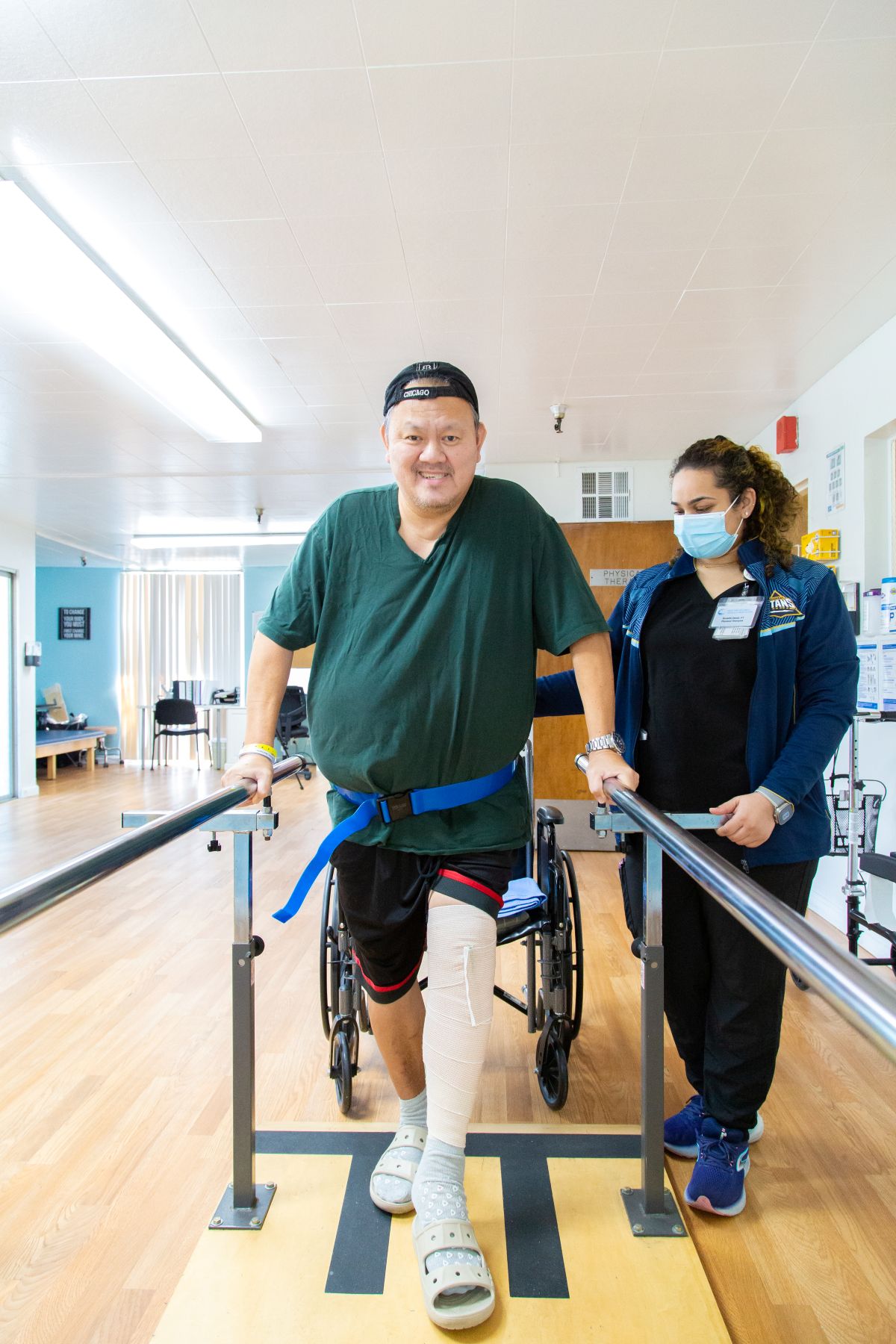 pacific care nursing patient getting strength traning verticle view